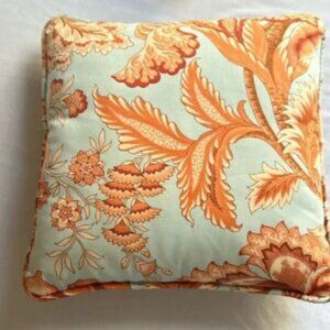 Orange and blue decorator pillow, 14X 14 in
